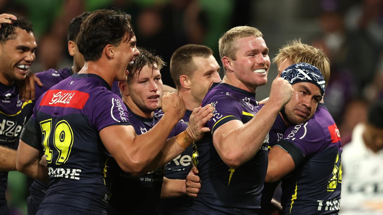 MELBOURNE, AUSTRALIA - APRIL 04: Jahrome Hughes of the Storm celebrates with team mates after scoring a try during the round five NRL match between Melbourne Storm and Brisbane Broncos at AAMI Park on April 04, 2024, in Melbourne, Australia. (Photo by Robert Cianflone/Getty Images)