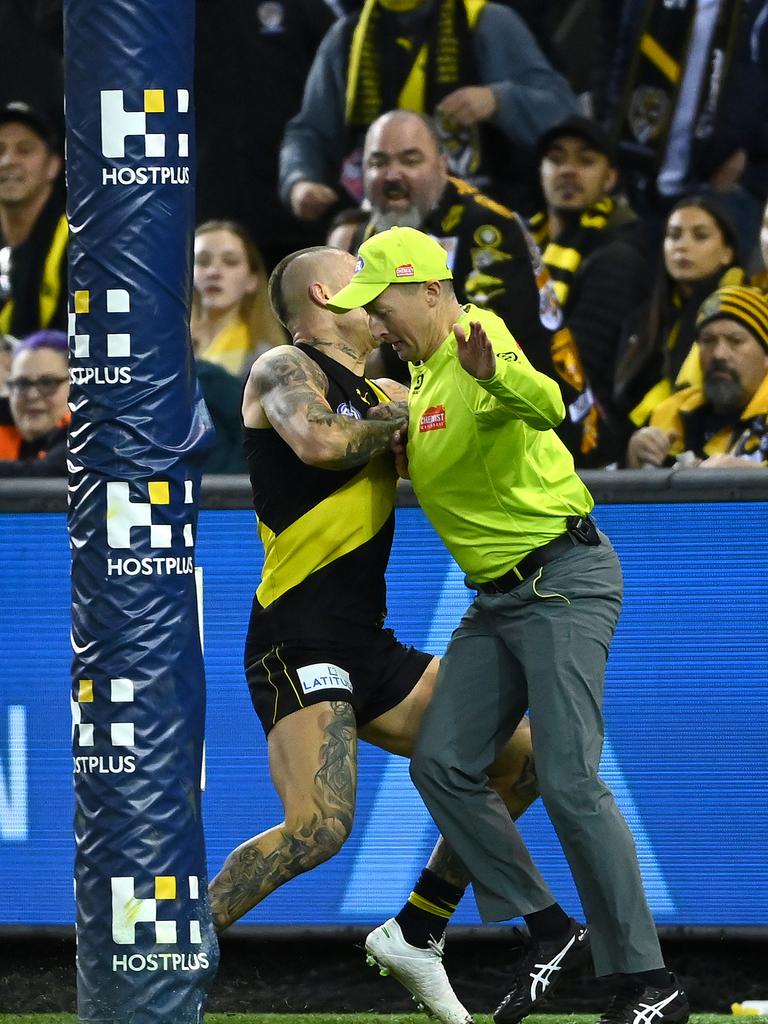 Dustin Martin of the Tigers collided with the goal umpire when he soccered through a goal in the dying stages. Picture: Quinn Rooney/Getty Images