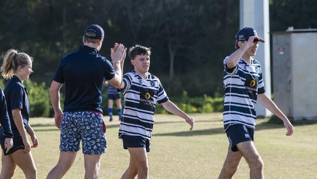 Players high five after a match.