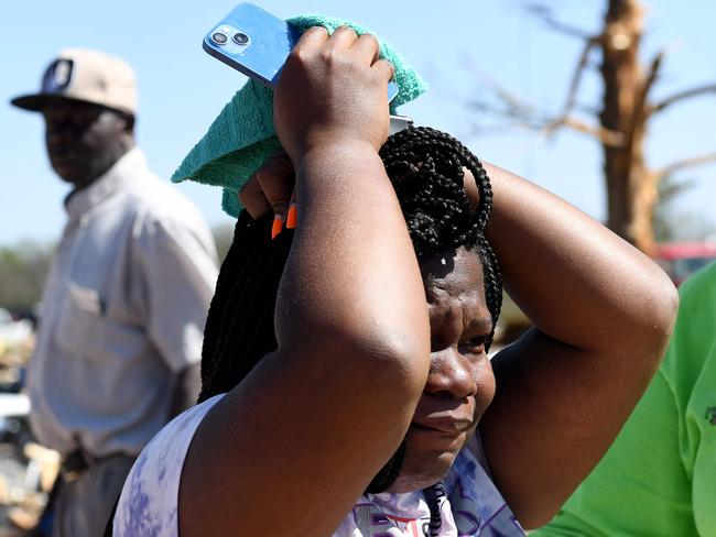 A Rolling Fork resident becomes emotional after assessing damage to her home. Picture: Getty Images via AFP