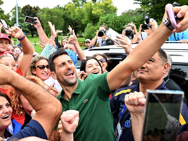 Novak Djokovic is mobbed by fans. Picture: Saeed Khan/AFP