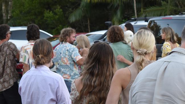 Taj Henderson’s family embraced each other lovingly as the hearse disappeared from view. Photo: Elizabeth Neil