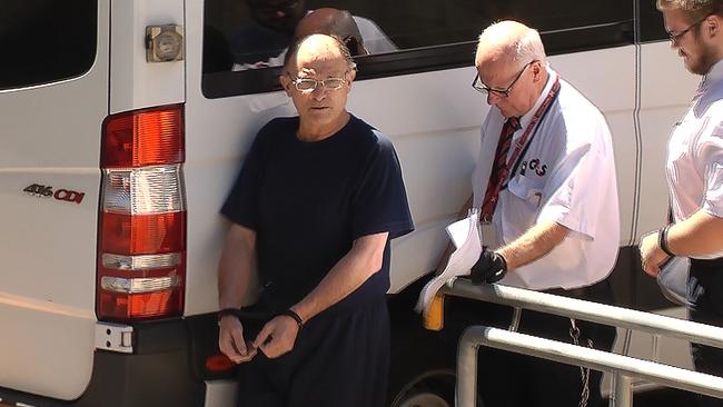 Domenic Perre is led into Adelaide Magistrates Court in 2018. Picture: 9 News