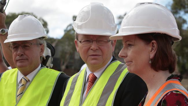 Former prime minister Kevin Rudd, centre, flanked by Wayne Swan and Julia Gillard.