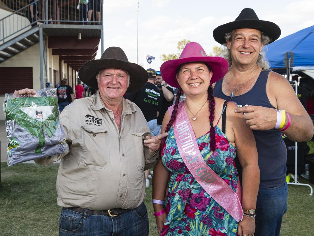 Angelica Williams celebrates her birthday with Michael Hall (left) and Davie Spresser at Lights on the Hill Trucking Memorial at Gatton Showgrounds, Saturday, October 5, 2024. Picture: Kevin Farmer