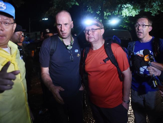 Three British cave divers, Richard William Stanton (second left), Robert Charles Harper (third left) and John Volanthen (right) were the first to find the boys and their coach in the cave. Picture: AFP