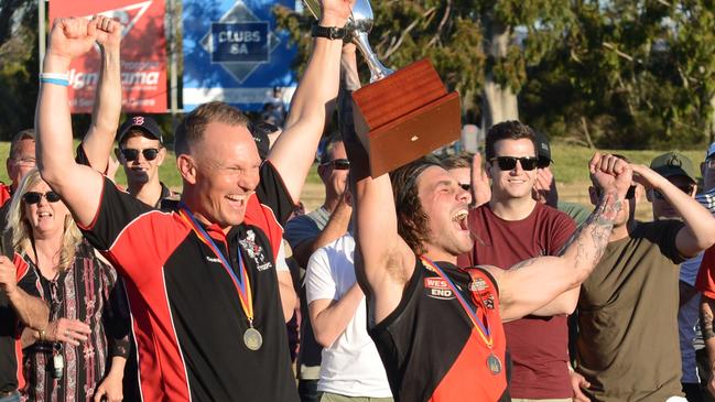 McKay celebrating the 2018 premiership with former TTG coach Justin Maschotta. Picture: Brenton Edwards)