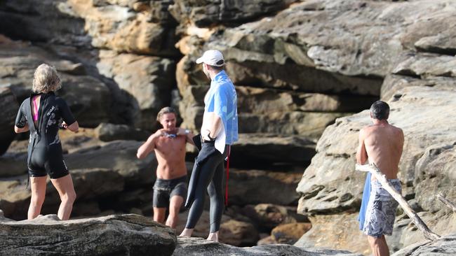 Police tape blocks the entry to Gordon’s Bay beach but people were seen climbing through to enjoy a swim. Picture John Grainger