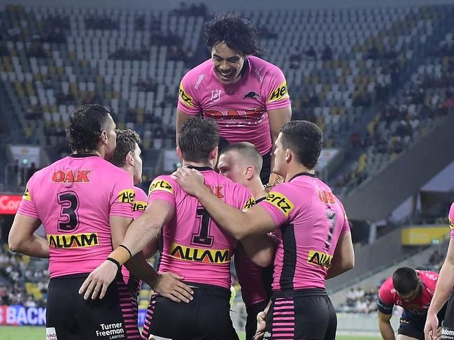 The Panthers celebrate after scoring an early try against the Cowboys. Picture: Ian Hitchcock/Getty Images