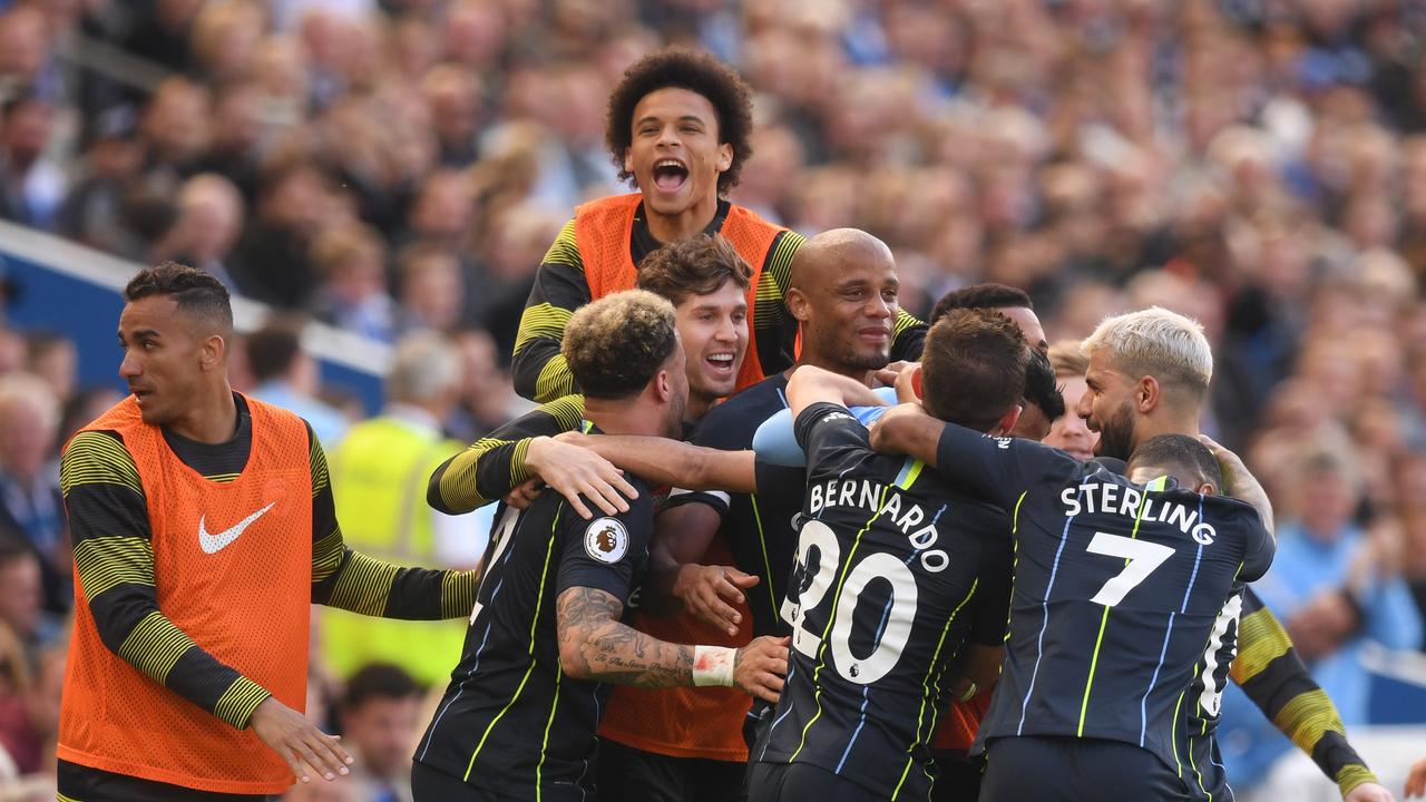 Riyad Mahrez of Manchester City celebrates with teammates after scoring his team's third goal