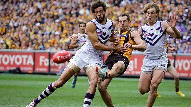 Fremantle's Zac Clarke tries to stop Hawthorn's Luke Hodge during last year's Grand Final. Picture: George...