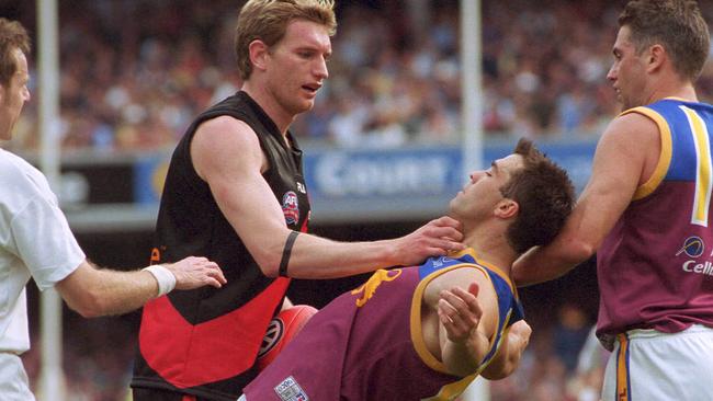 James Hird tangles with Chris Scott in the 2001 Grand Final.