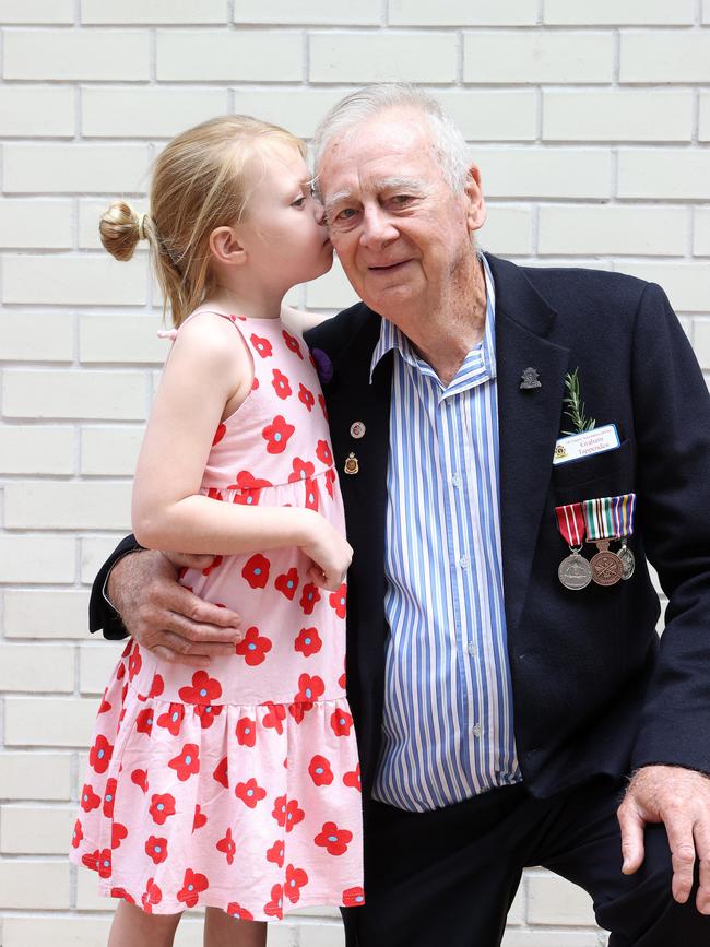 Graham Tappenden, 78, of Woolloongabba with grandaughter Wynta Meagher, 7, at the 2023 ANZAC day march in Brisbane. Picture: Liam Kidston