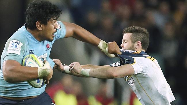 Waratahs lock Will Skelton brushes off Brumbies defender Robbie Coleman.