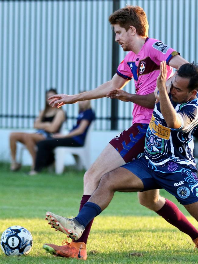 Action between Estates FC and MA Olympic.