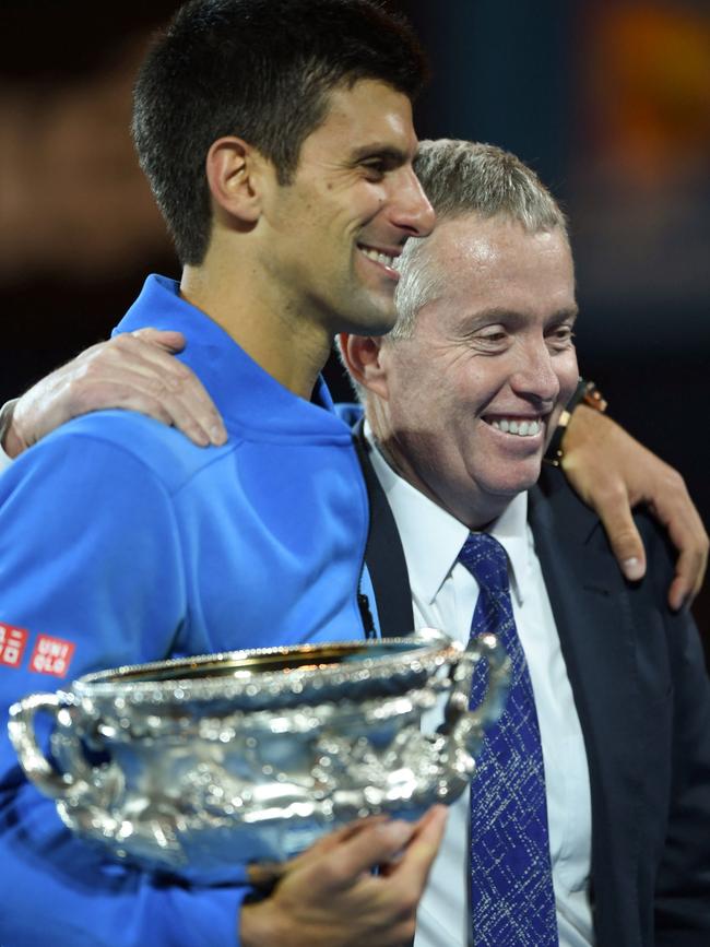 Novak Djokovic smiles with tournament director Craig Tiley.