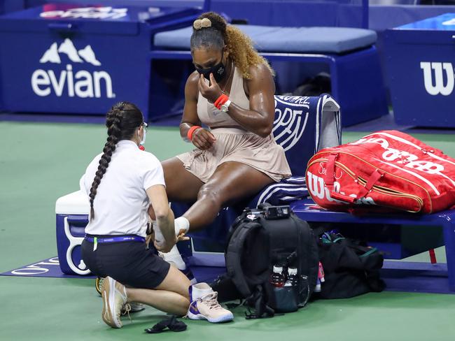 NEW YORK, NEW YORK - SEPTEMBER 10:  Serena Williams of the United States has her ankle retaped in the third set during her Women's Singles semifinal match against Victoria Azarenka of Belarus on Day Eleven of the 2020 US Open at the USTA Billie Jean King National Tennis Center on September 10, 2020 in the Queens borough of New York City. (Photo by Matthew Stockman/Getty Images)