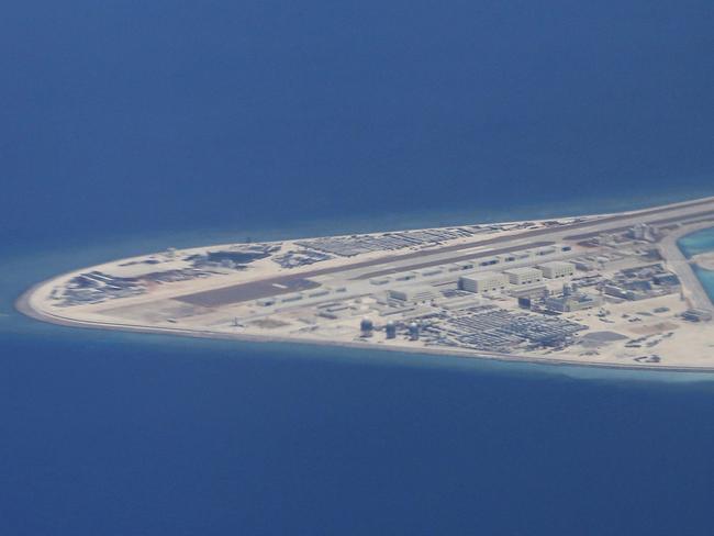 An airstrip, structures and buildings on China's manmade Subi Reef in the Spratly chain of islands in the South China Sea. Picture: AP Photo/Bullit Marquez