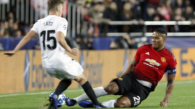 Manchester United’s Antonio Valencia, right, tackles Valencia defender Antonio Lato during their Champions League match earlier this week. Picture: AP