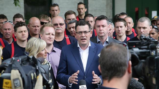 Daniel Andrews campaigning with fire fighters. Picture: Hamish Blair