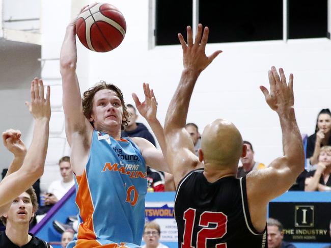 Marlins' Ky Stattmann drives to the basket in the NBL1 North match between Cairns Marlins and the Southern District Spartans at the Cairns Basketball Stadium. Picture: Brendan Radke