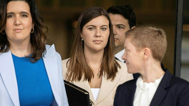 Brittany Higgins, centre, leaves the ACT Magistrates Court in Canberra on Wednesday. Picture: AFP