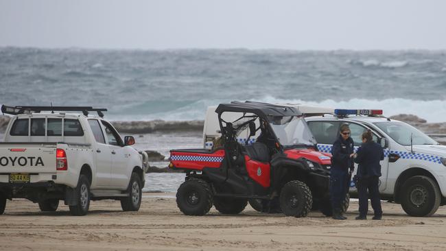 Police at the scene on Wanda Beach. Picture John Grainger