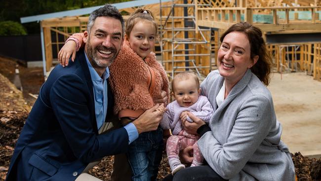 Nathan and Heike Godfrey with kids Hazel, 4, and Eugenie, 7 months, at the building site of their new Crafers home.Picture: Tom Huntley