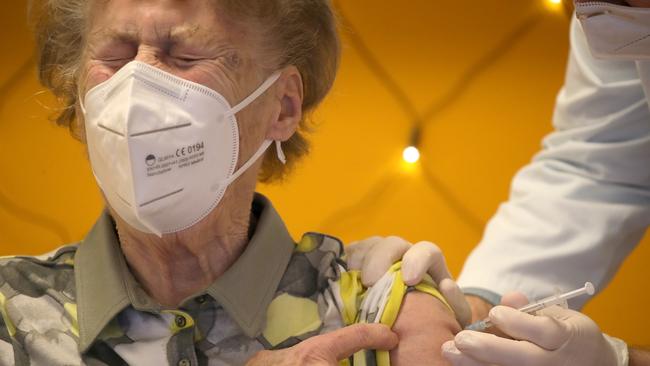 Annelise May receives the Pfizer/BioNTech vaccine in Cologne, Germany, on Sunday. Picture: Getty Images