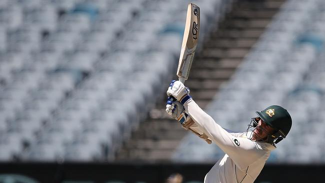 Mitchell Starc smashes a six against Pakistan at the MCG. Picture: Wayne Ludbey