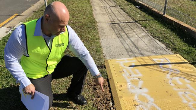 Canterbury Bankstown councillor Steve Tuntevski points out the asbestos lining at one of the Telecom pits at Marco Ave, Panania. Picture: Lawrence Machado