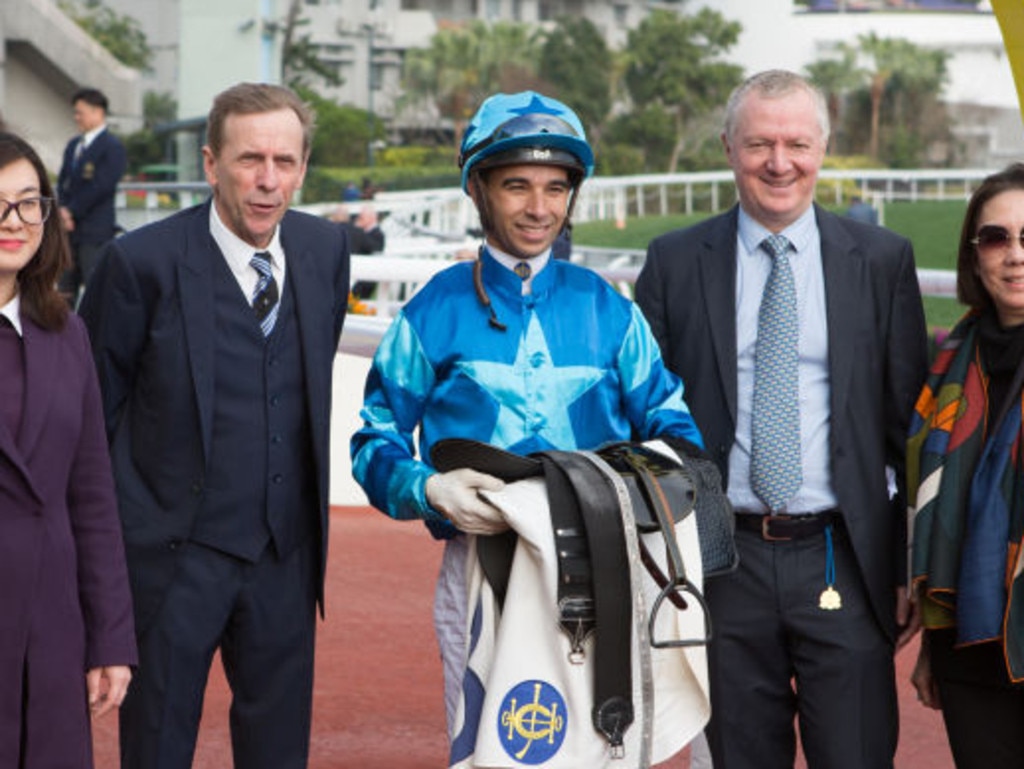 HONG KONG, HONG KONG - FEBRUARY 2 : 
  Jockey Joao Moreira, trainer John Size, racehorse trader David Price and owners celebrate after Tornado Twist wins Race 7 The Pearce Memorial Challenge Cup at Sha Tin racecourse on February 2, 2019 in Hong Kong. (Photo by Lo Chun Kit /Getty Images)