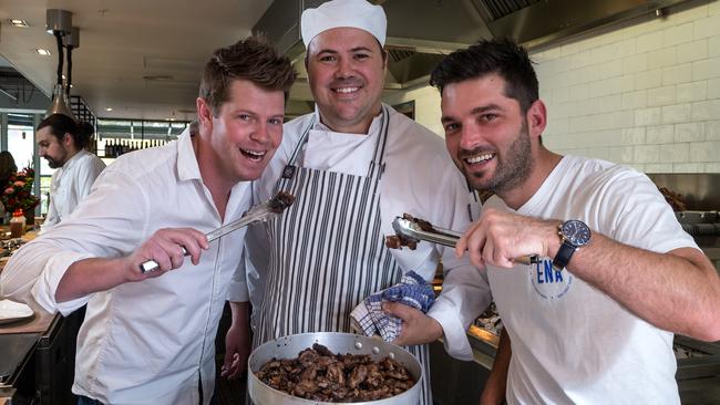 Ena Greek street food owner Sean Chesire offering lamb to Reno Rumble star Chris Stavropoulos. Picture: Mark Dadswell