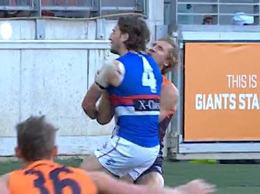 Marcus Bontempelli crunches Nick Haynes.