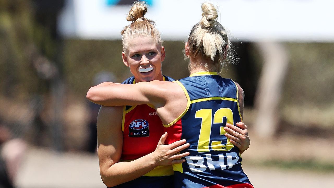 Ashleigh Woodland celebrates one her four goals with Erin Phillips. Picture: Sarah Reed/AFL Photos via Getty Images