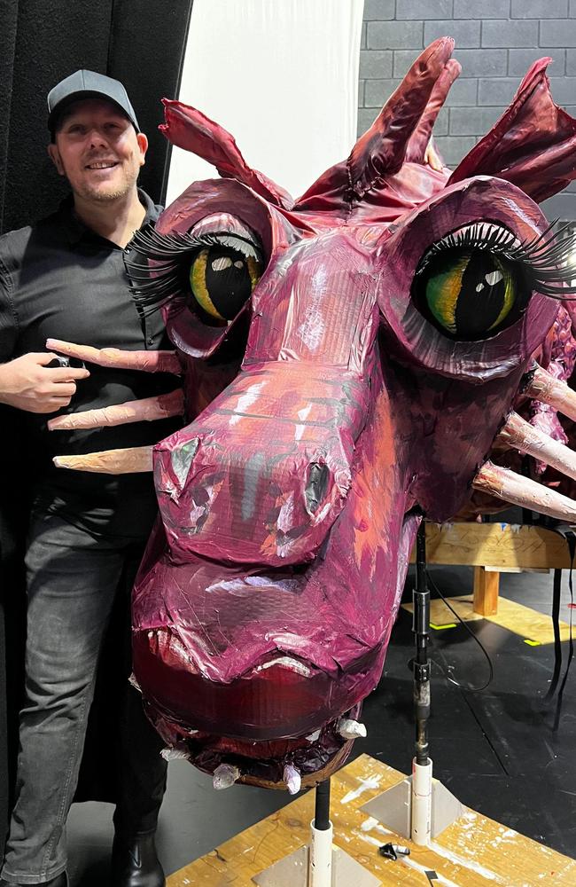 Triple M radio announcer Jay Shipston with the dragon from Shrek the Musical put on by Mackay Musical Comedy Players at the MECC. Picture: Contributed