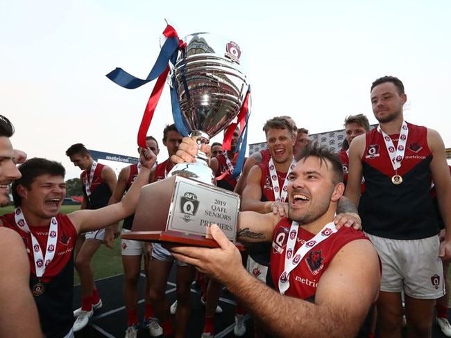 Demons premiership player Dan Green celebrates winning the 2019 QAFL grand final. Photo: Jason O'Brien Photography