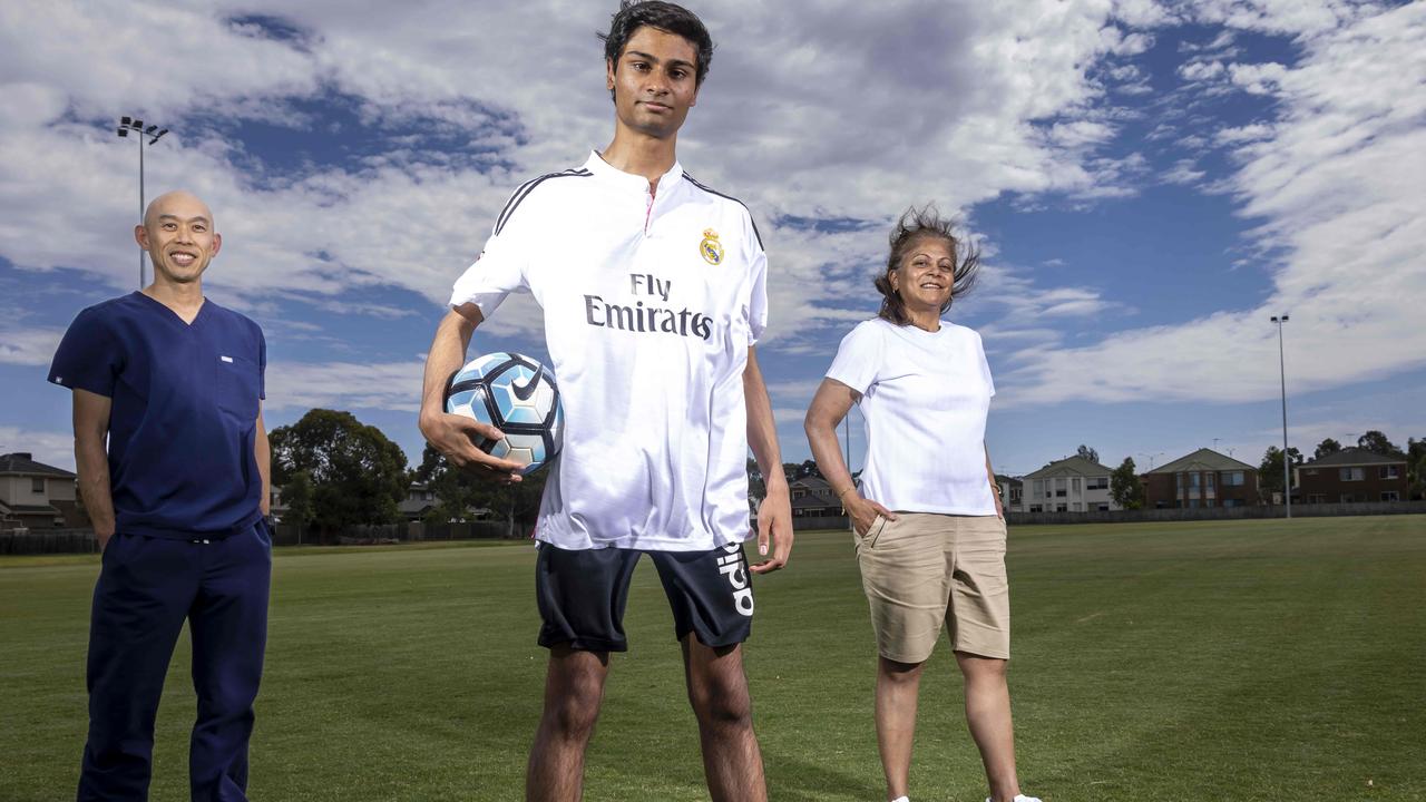 Dr Low with Nathan and his mum Queenie, who was determined to find an answer to her son’s medical mystery. Picture: Wayne Taylor