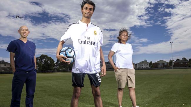 Dr Low with Nathan and his mum Queenie, who was determined to find an answer to her son’s medical mystery. Picture: Wayne Taylor