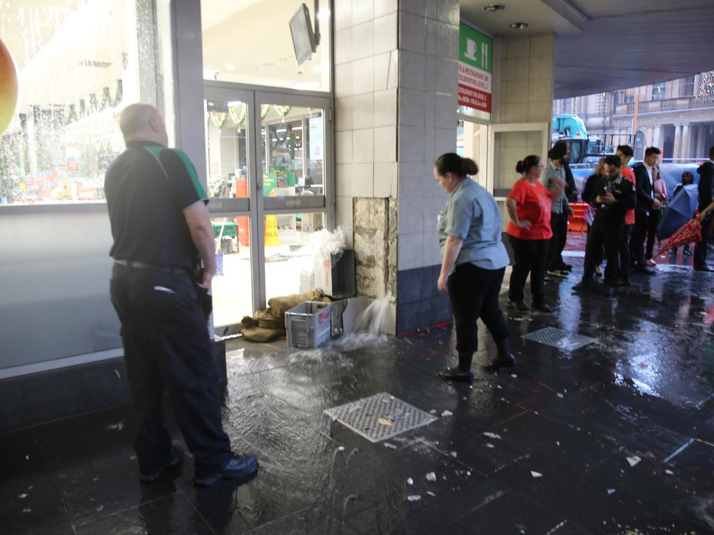 The low hits Sydney at Sunrise . Woolworths at Town hall station is flooding .picture John Grainger