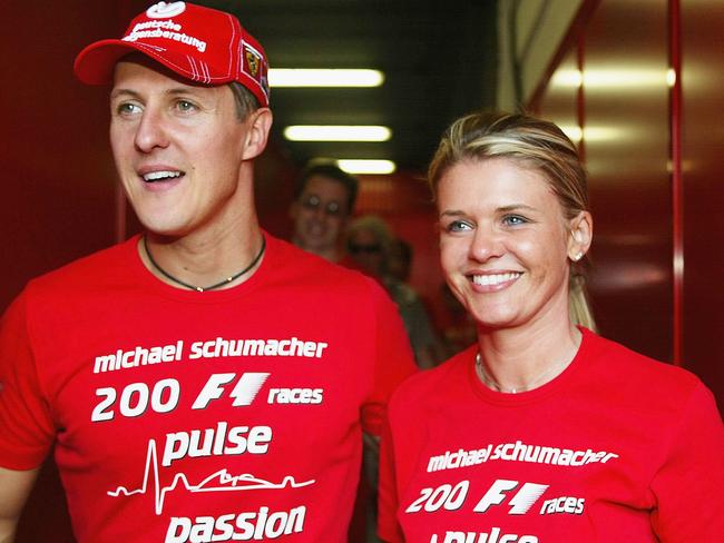 BARCELONA, SPAIN - MAY 9:  Michael Schumacher of Germany and Ferrari celebrates with his wife Corinna after competing in his 200th Grand Prix during the Spanish F1 Grand Prix on May 9, 2004, at the Circuit de Catalunya in Barcelona, Spain. (Photo by Getty Images)