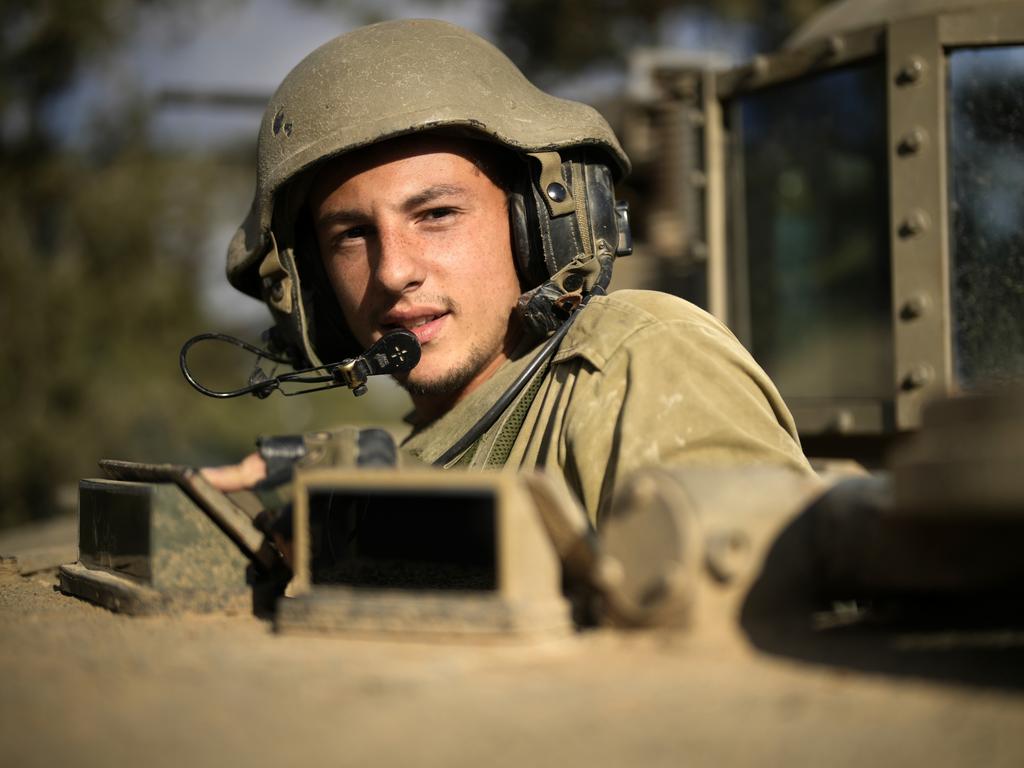 Israeli soldiers leave for Gaza in their armoured fighting vehicle in southern Israel. Picture: Getty Images