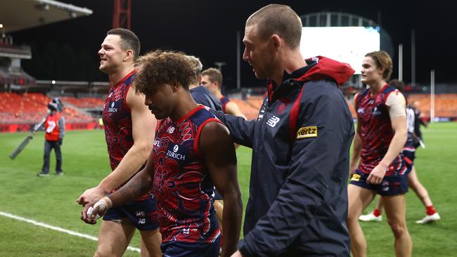 Kysaiah Pickett walks off the field with Simon Goodwin after the match. Picture: Cameron Spencer/AFL Photos/via Getty Images