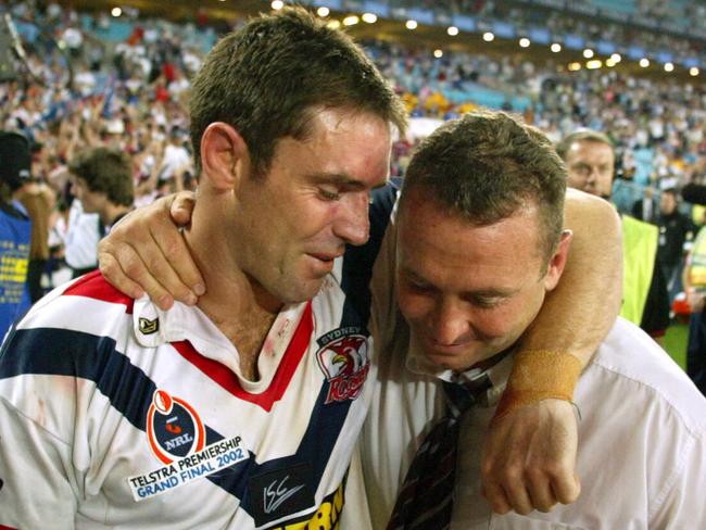 OCT 06, 2002: Captain Brad Fittler (L) hugs coach Ricky Stuart after Sydney Roosters defeated NZ Warriors in 2002 NRL rugby league Grand Final at Stadium Australia. PicMark/Evans. sport
