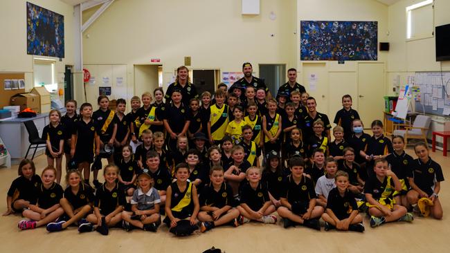 Kids at The Lakes primary school posing for photos with their Tiger heroes