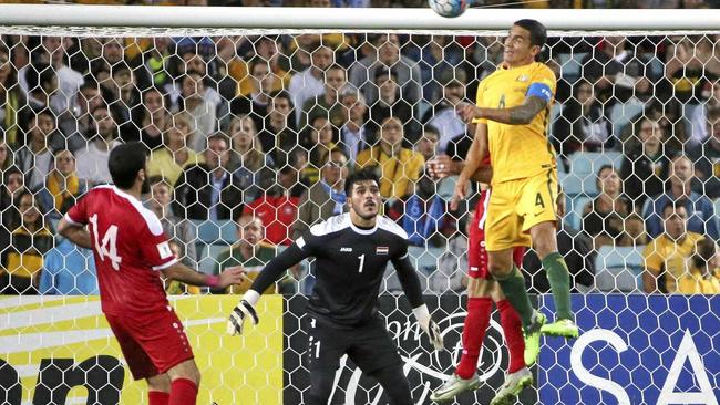 TRADEMARK: Australia&#39;s Tim Cahill, right, scores another towering header against Syria during their World Cup qualifying match in Sydney, Australia, Tuesday, Oct. 10, 2017. Picture: Rick Rycroft