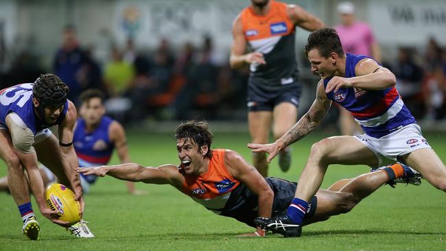 Caleb Daniel swoops after Caleb Smith bowls over Ryan Griffen. Picture: Wayne Ludbey