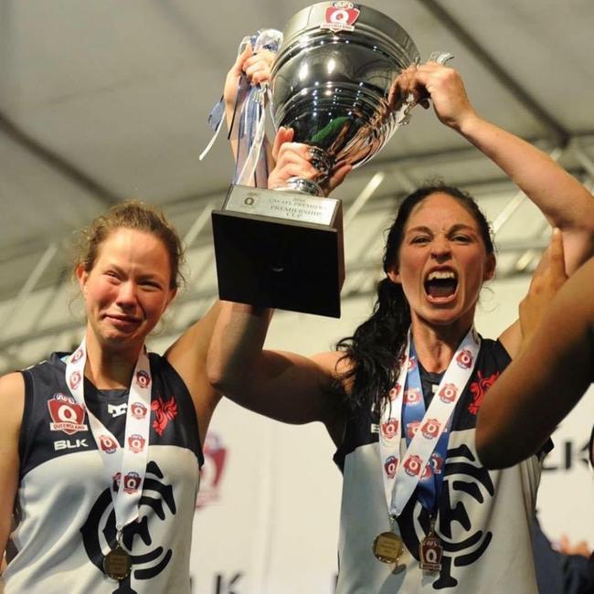 Lauren James (left) and Leah Kaslar (right) celebrate winning the 2016 QWAFL premiership. Pic: Supplied.