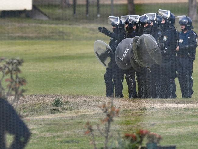 Riot police are seen during the riot. Picture: Dean Lewins