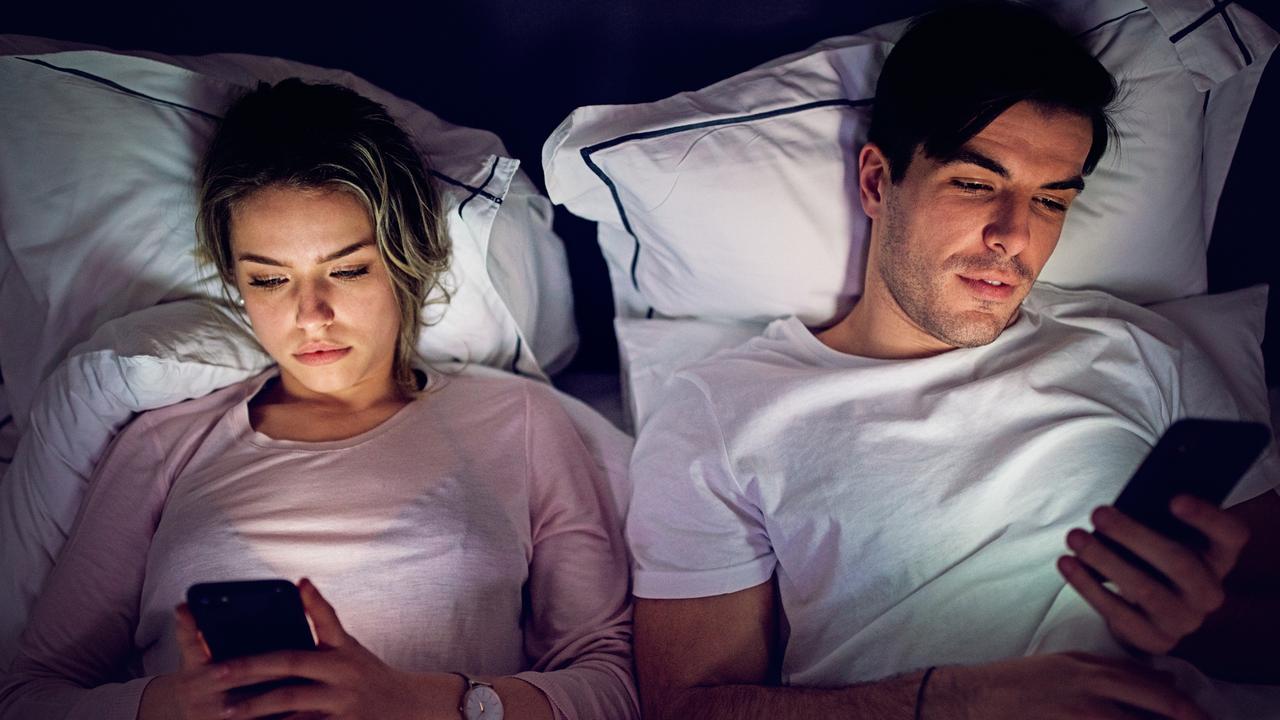 “In modern relationships, it's so common for a couple to get into bed and be looking at their phones and that really detracts from intimacy and connection with your partner,” says Ms Hosking. Picture: iStock